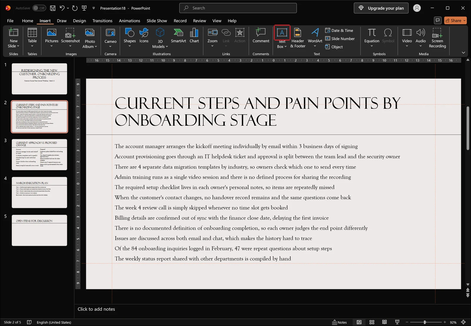 PowerPoint Insert tab with the Text Box command highlighted in the Text group