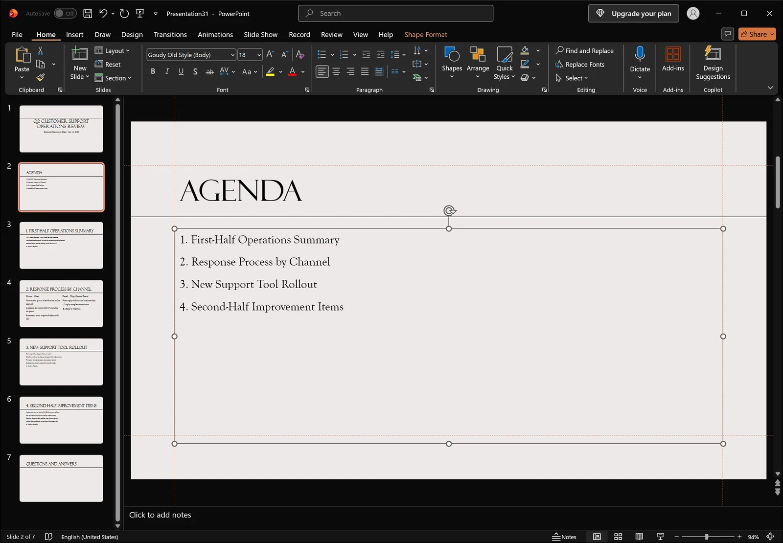 PowerPoint normal view with the agenda body placeholder selected showing selection handles