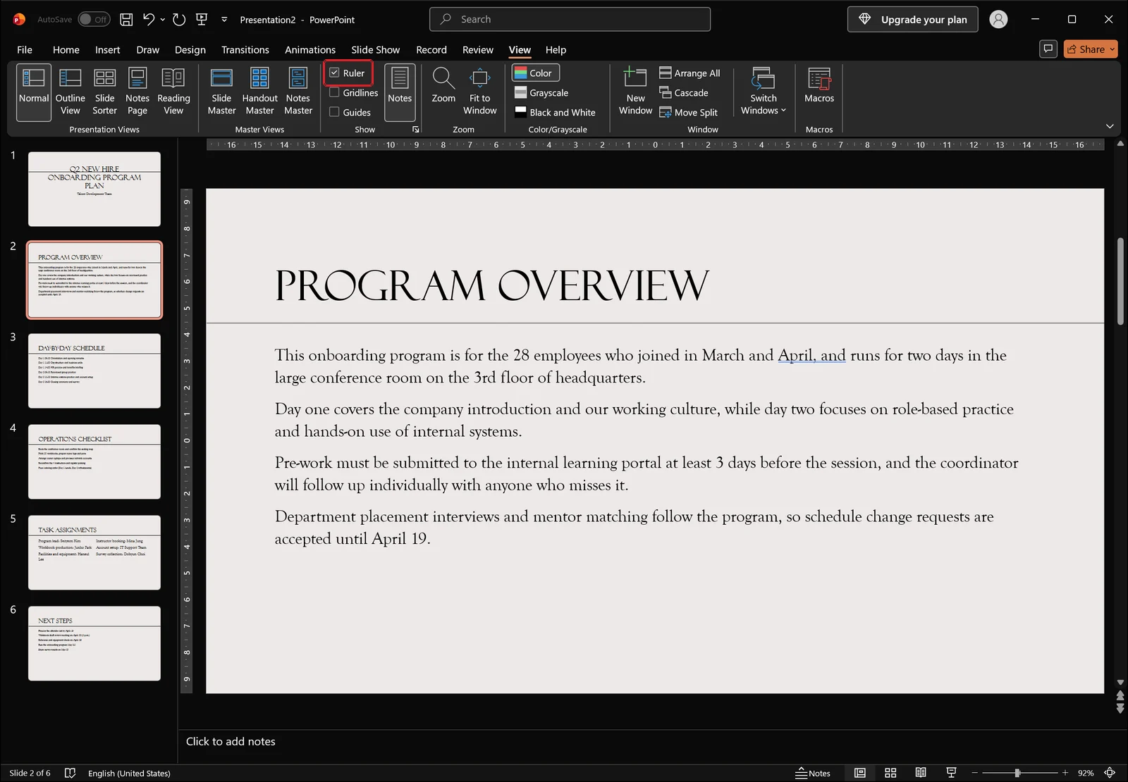 PowerPoint View tab with the Ruler checkbox turned on and a horizontal ruler shown above the slide, red box on the Ruler checkbox