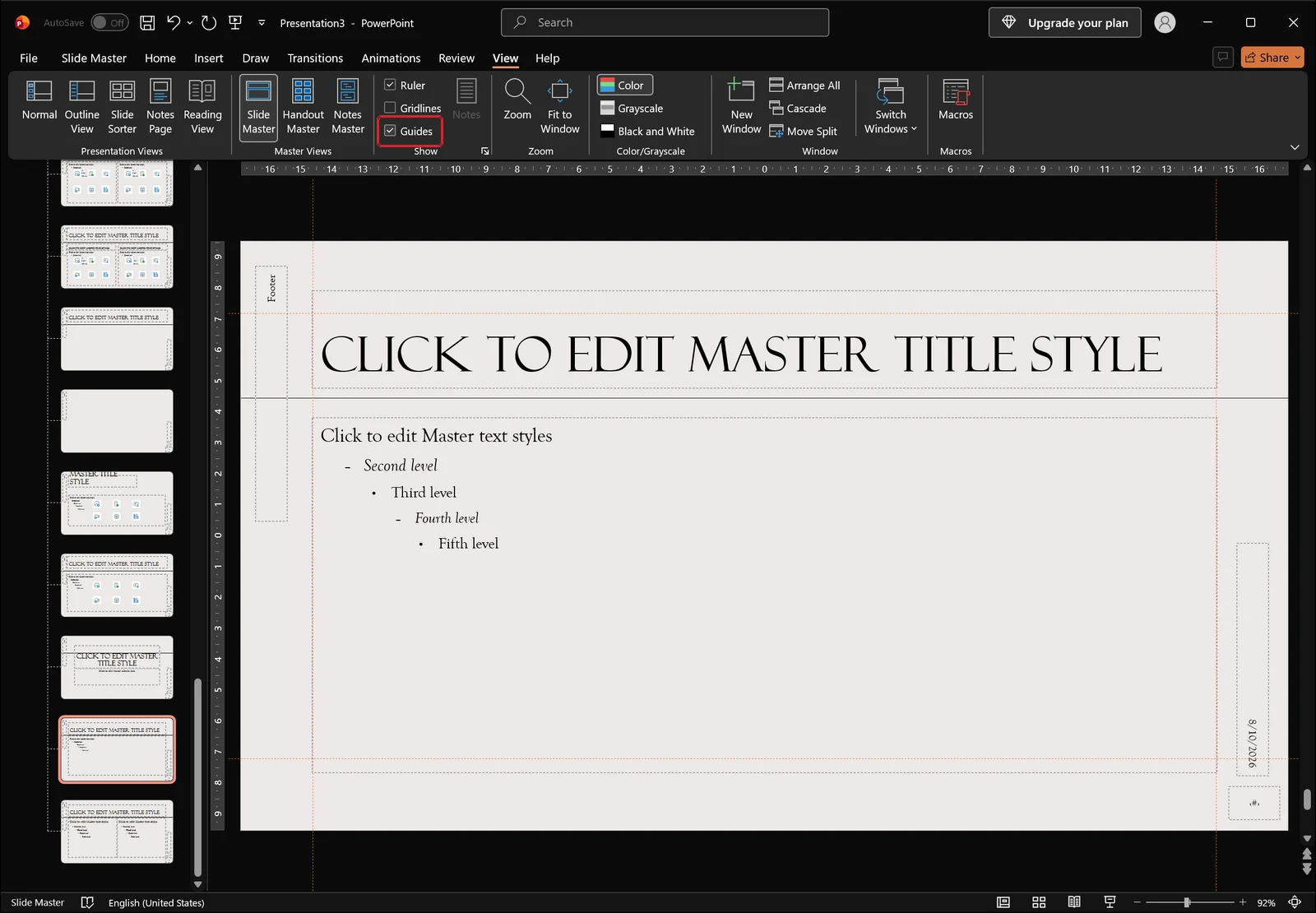 Slide Master view with guides turned on showing dashed alignment lines across the master slide, Guides checkbox highlighted