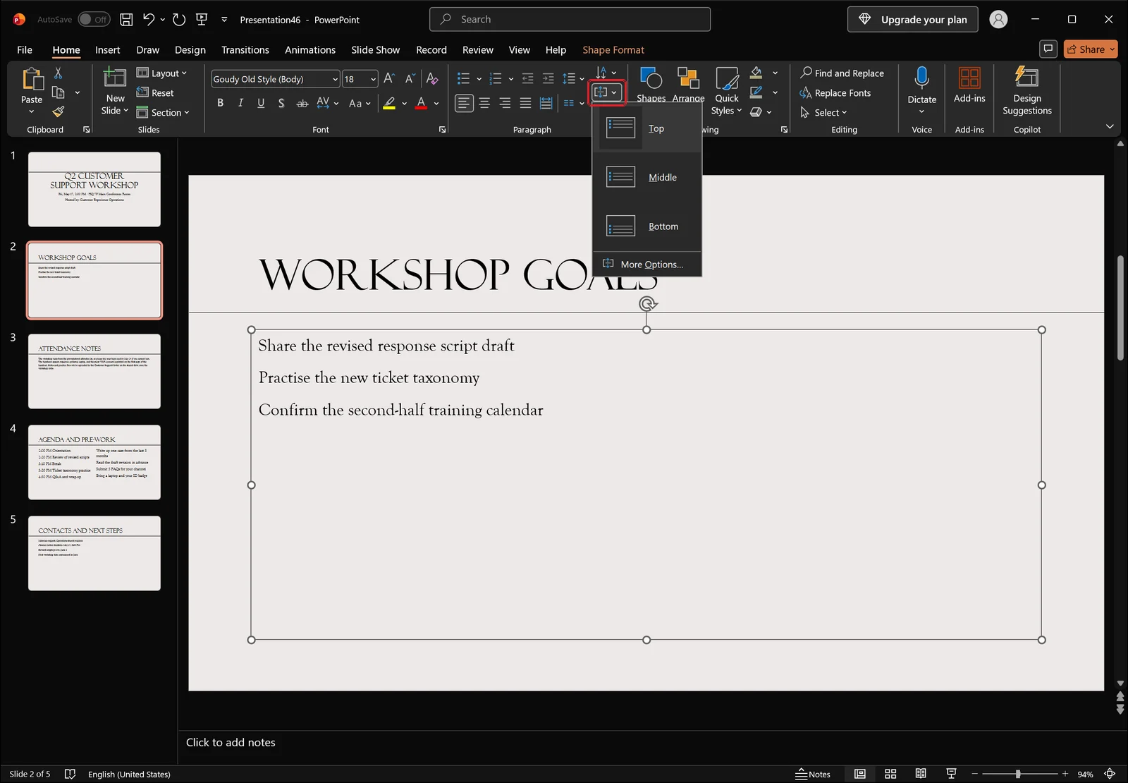 PowerPoint Home tab with the align text dropdown open listing top, middle and bottom vertical alignment options
