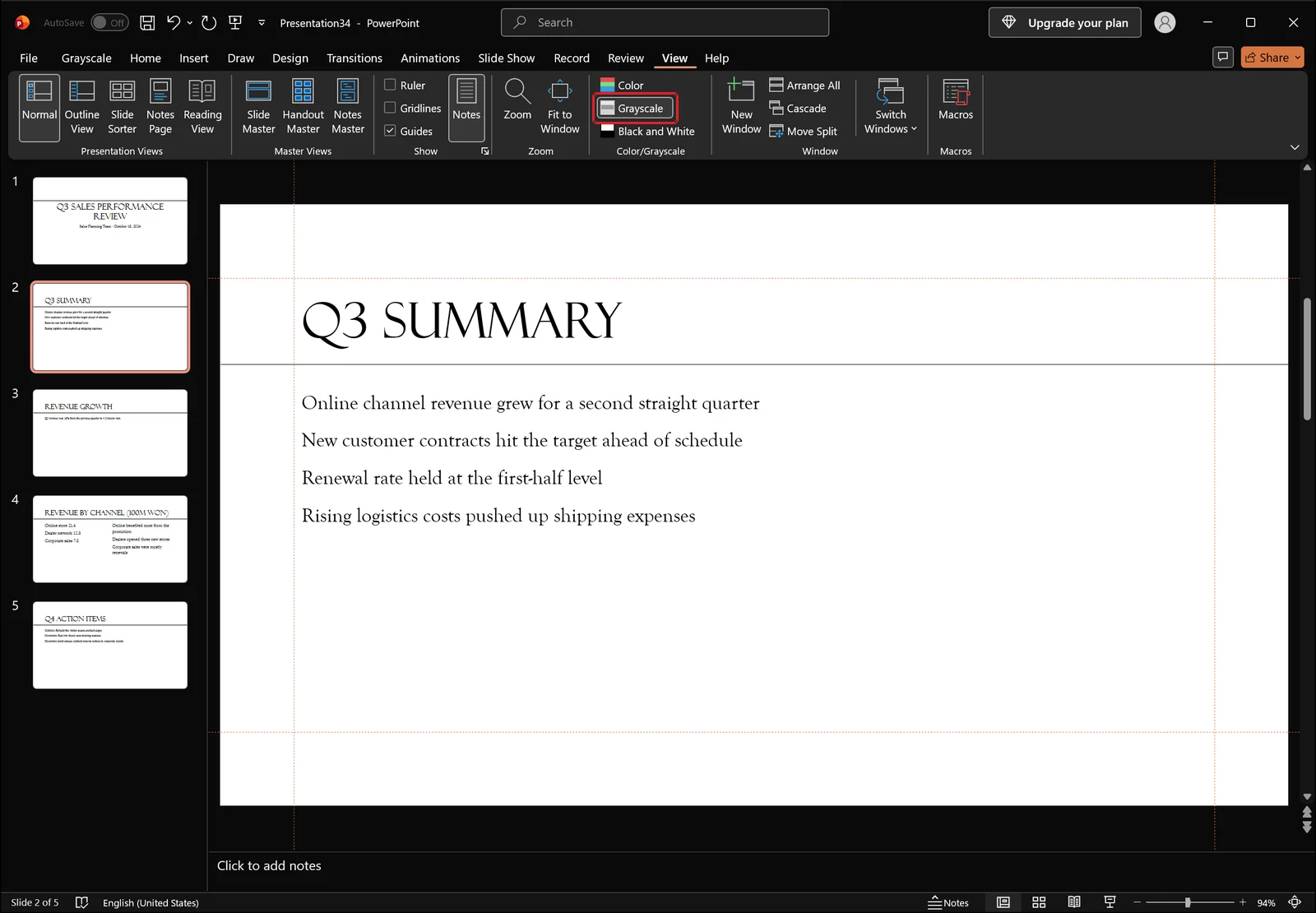 PowerPoint switched to Grayscale from the View tab so the slide and thumbnails show without color, with a red box on the Grayscale button.